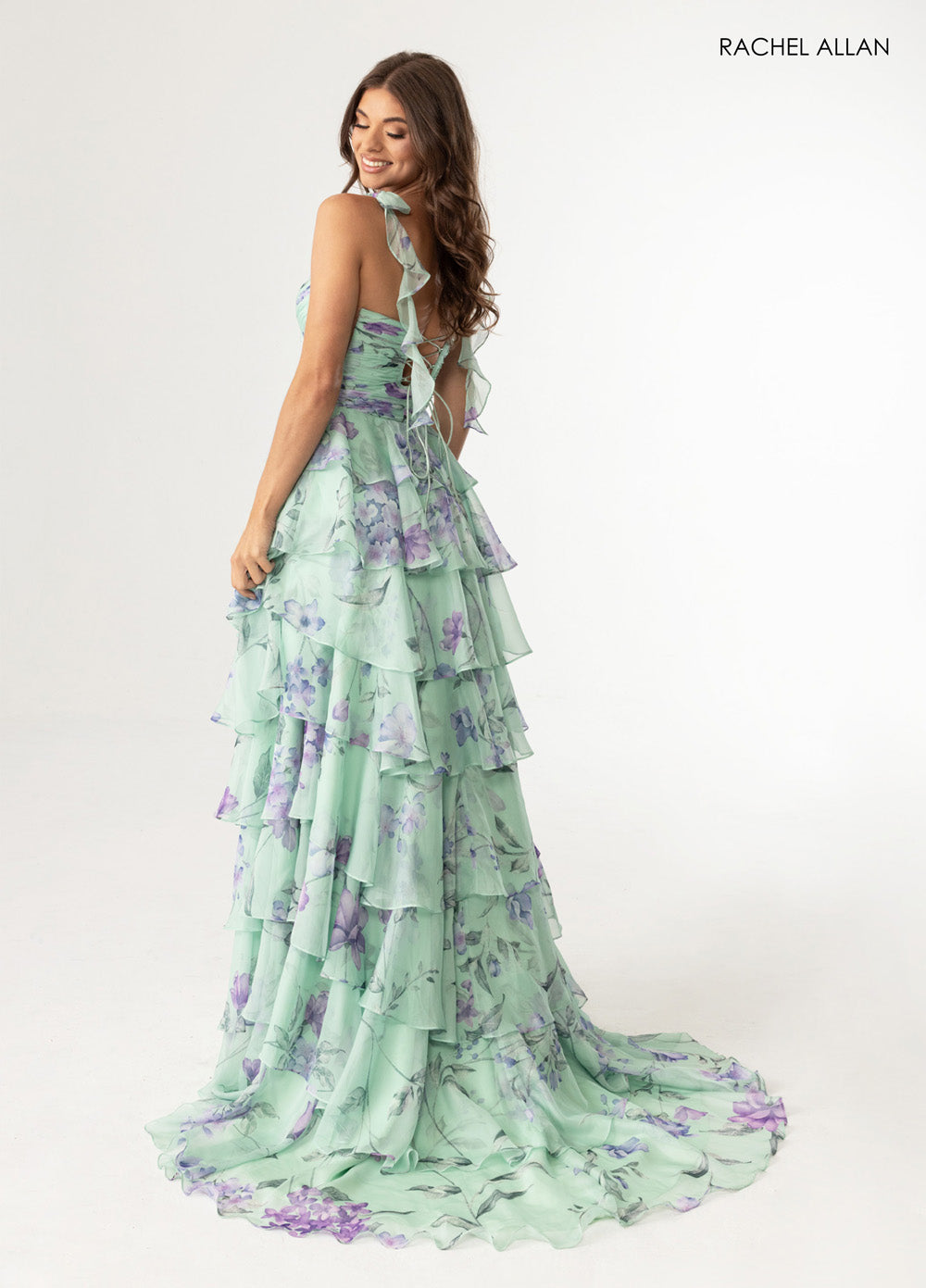 Rachel Allan 70953 A-line prom dress in sage multi with ruffled layers and lace-up back, back view.