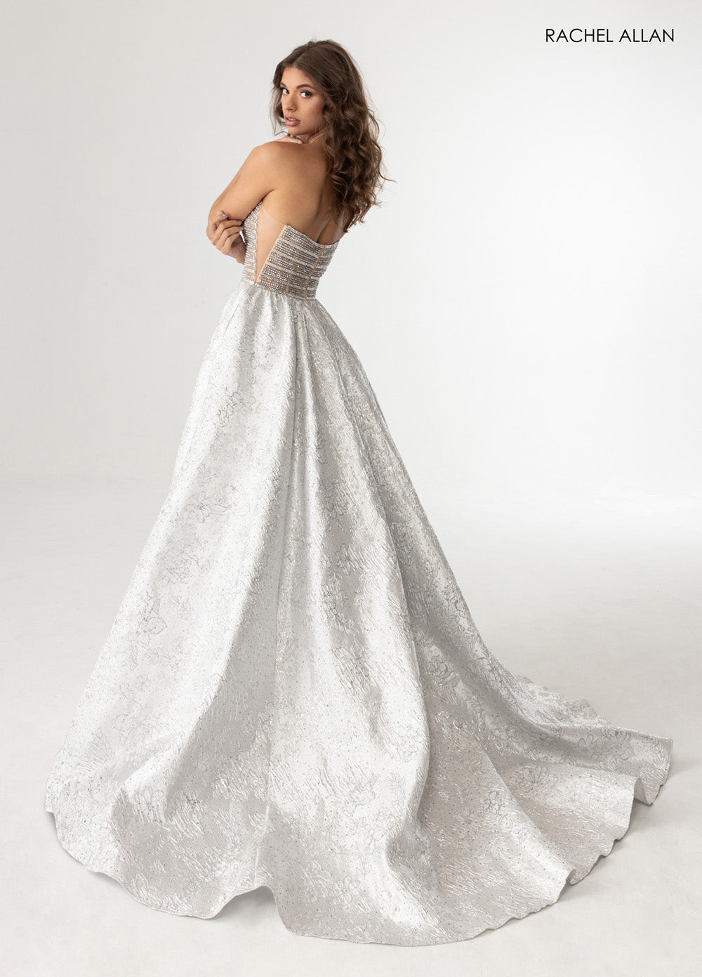 Rachel Allan 70956 Silver nude ballgown with crystal beading and a stunning open back prom dress.