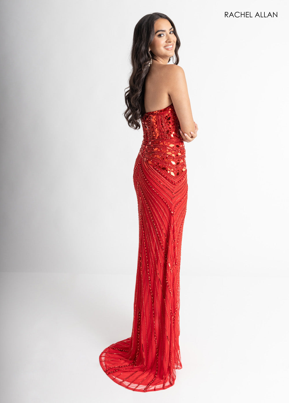 Rachel Allan 70964 Red fitted prom dress with beading and a stunning train, side view.