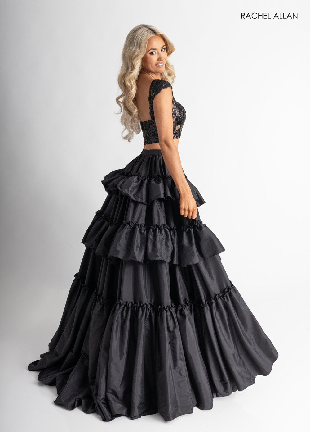 Rachel Allan 70966 Black ballgown with corset bodice and layered ruffle skirt, perfect for prom prom dress.