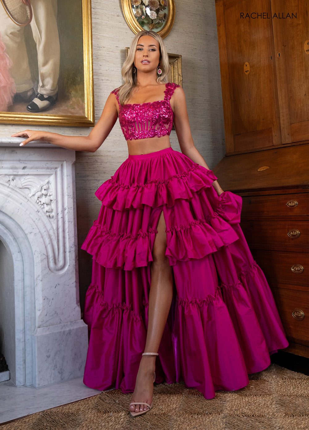 Rachel Allan 70966 Fuchsia prom dress with a corset bodice and high slit, featuring ruffled layers.