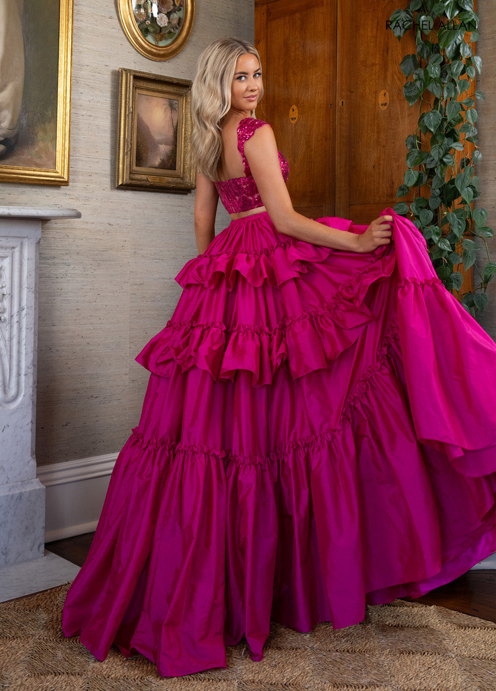 Rachel Allan 70966 Fuchsia prom dress with ruffled layers and a corset bodice, back view.