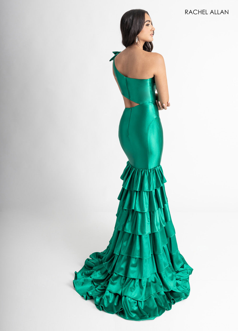 Rachel Allan 70976 Emerald green mermaid prom dress with a lace-up back and ruffled train.