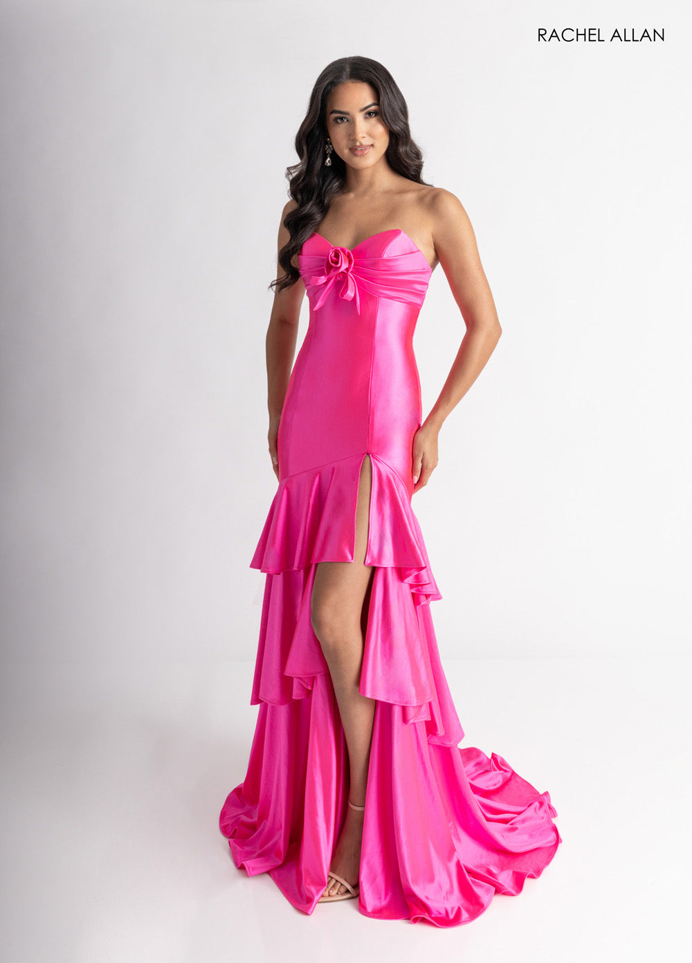 Rachel Allan 70987 Hot pink mermaid prom dress with 3D flowers and a thigh-high slit.