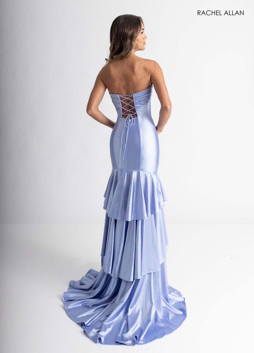 Rachel Allan 70987 Cloud blue mermaid prom dress with a lace-up back and layered ruffle skirt.