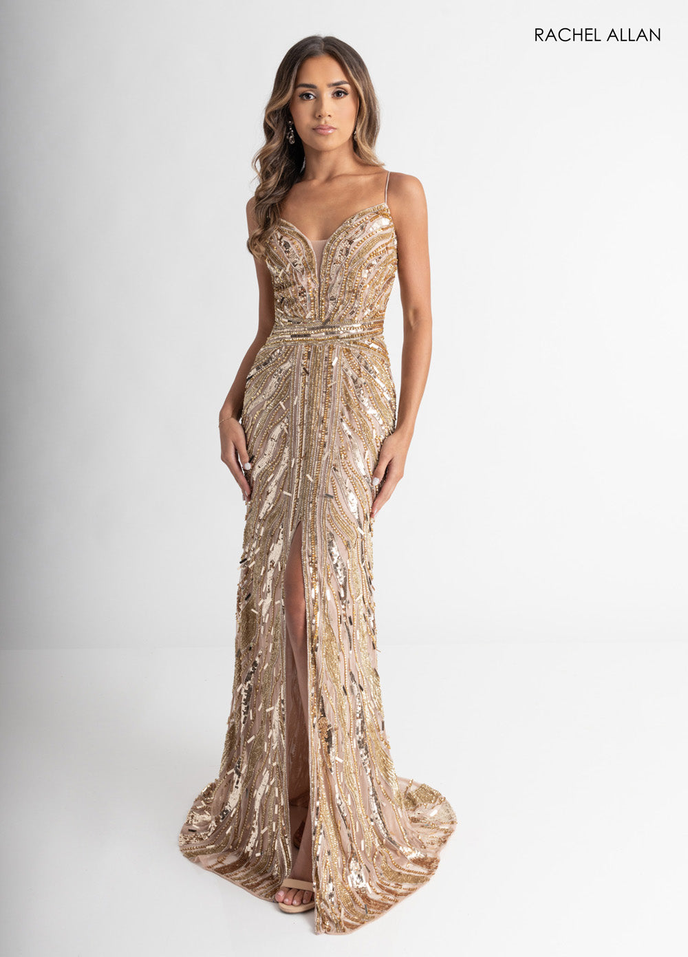 Rachel Allan 70990 Fitted nude gold prom dress with beading and a thigh-high slit, front view.