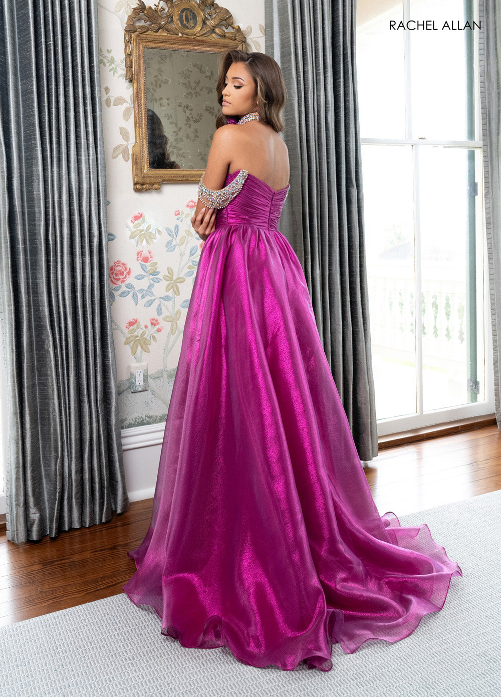 Rachel Allan 70991 Fuchsia prom dress with corset bodice and lace-up back, side view.