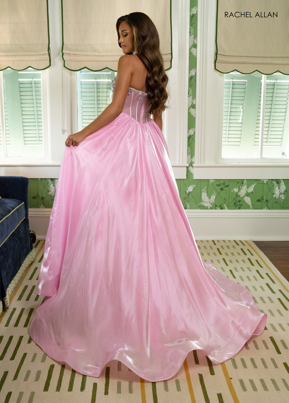 Rachel Allan 70998 Pink ballgown prom dress with corset bodice and flowing skirt, back view.