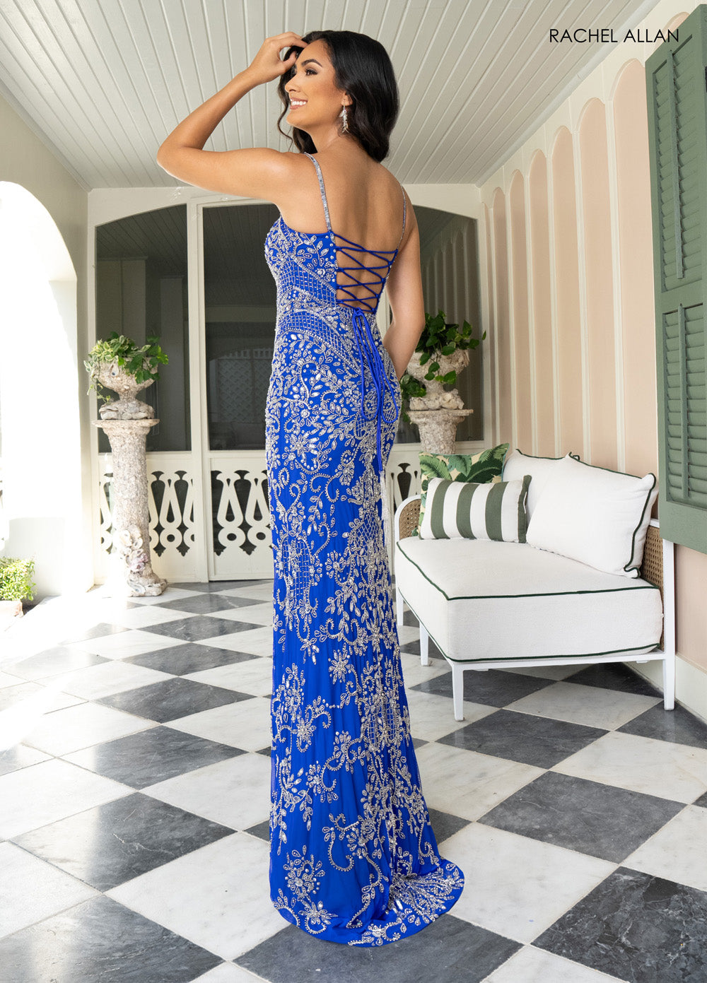 Rachel Allan 70999 Fitted royal blue prom dress with intricate beading and lace-up back.
