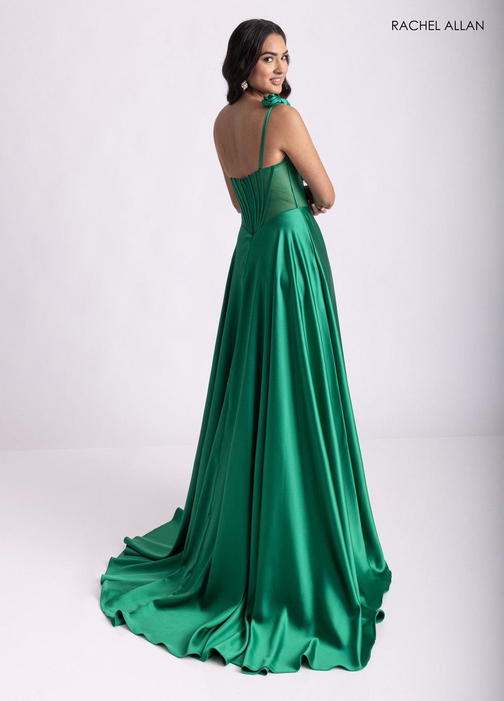 Rachel Allan 71004 Emerald satin prom dress with a corset bodice and lace-up back, side view.