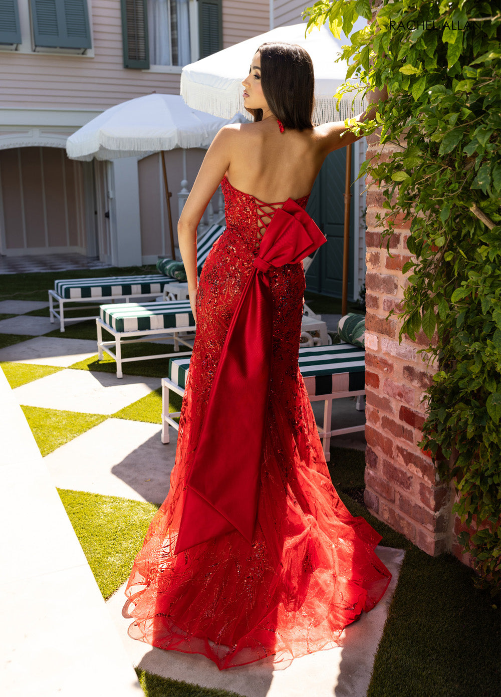Rachel Allan 71008 Red mermaid prom dress with crystal beading and lace-up back, back view.