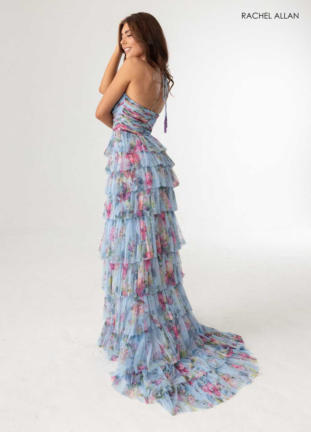 Rachel Allan 71010 Blue multi prom dress with tiered ruffles and a fitted silhouette.