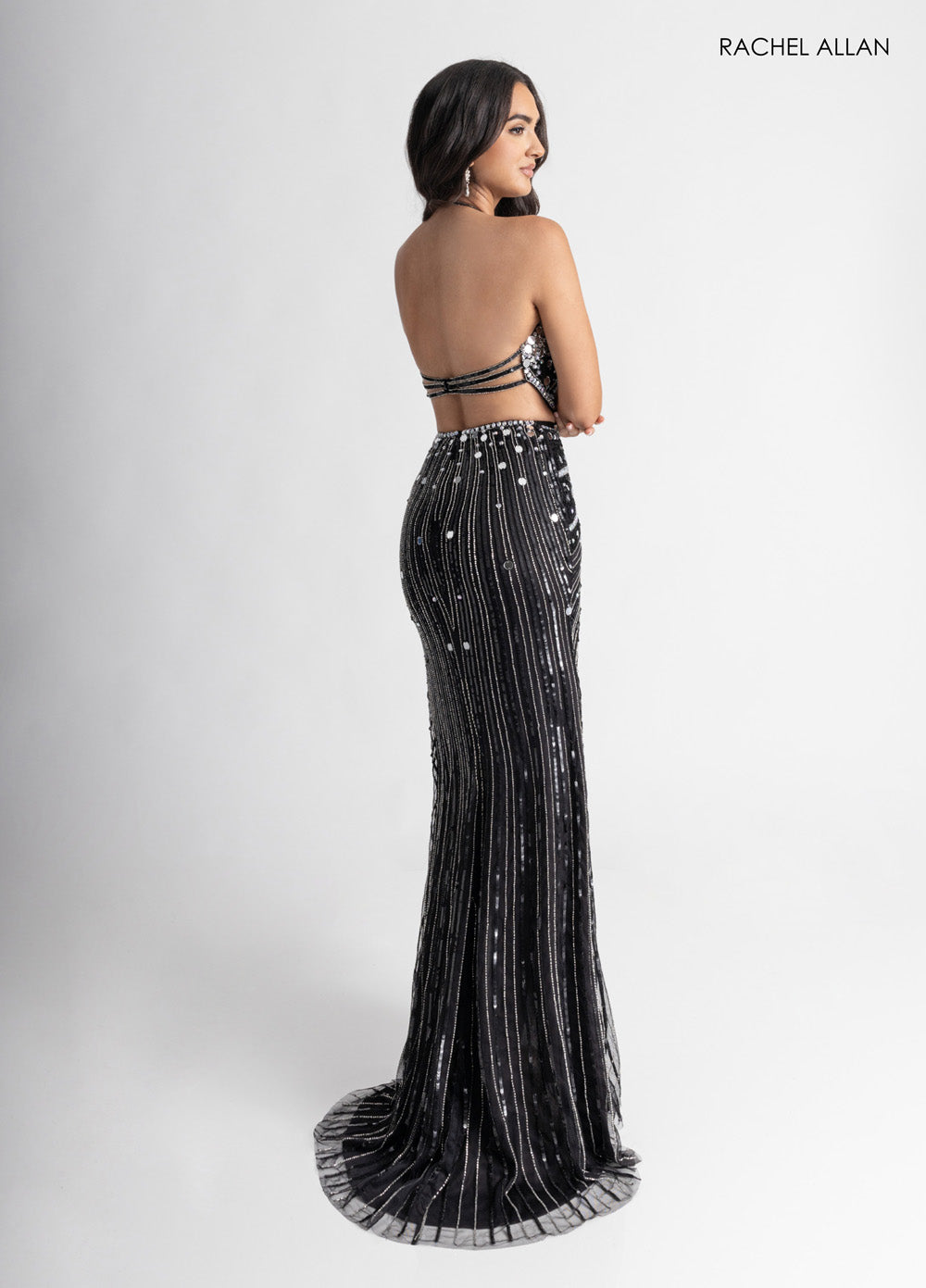Rachel Allan 71011 Black mermaid prom dress with beading and a stunning open back view.