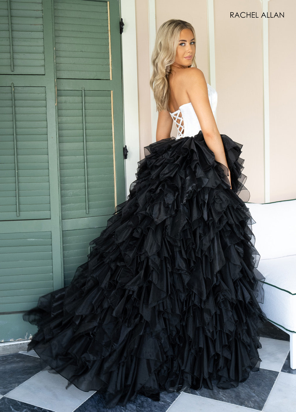 Rachel Allan 71018 Black ballgown with ruffled layers and lace-up back, perfect for prom prom dress.