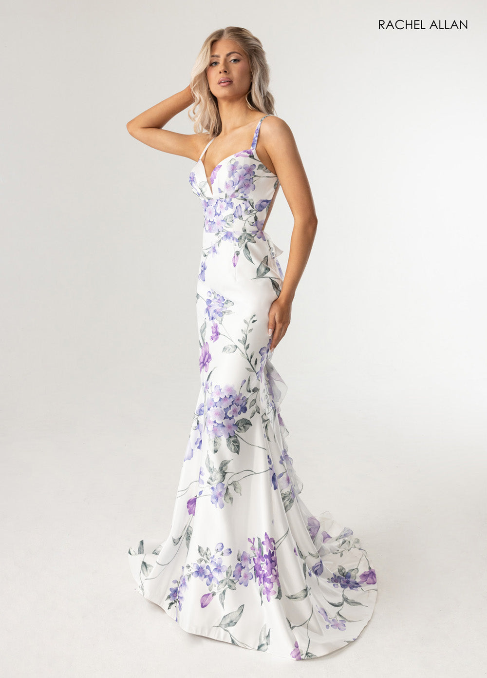 Rachel Allan 71023 Mermaid prom dress in white with floral print and a plunging neckline.