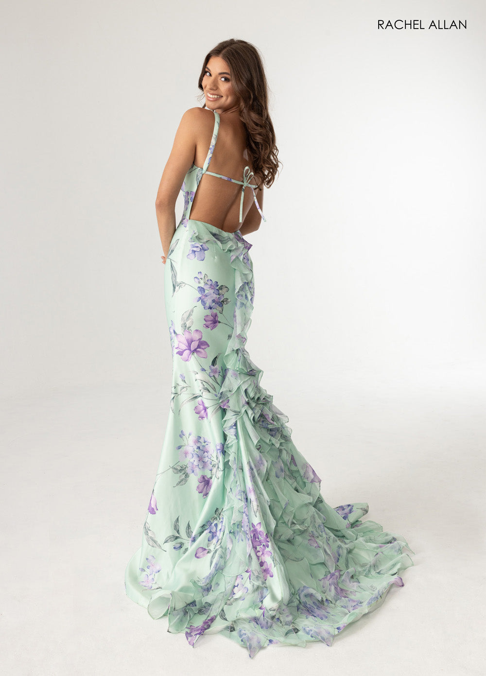 Rachel Allan 71023 Sage multi mermaid prom dress with ruffled train and lace-up back, back view.