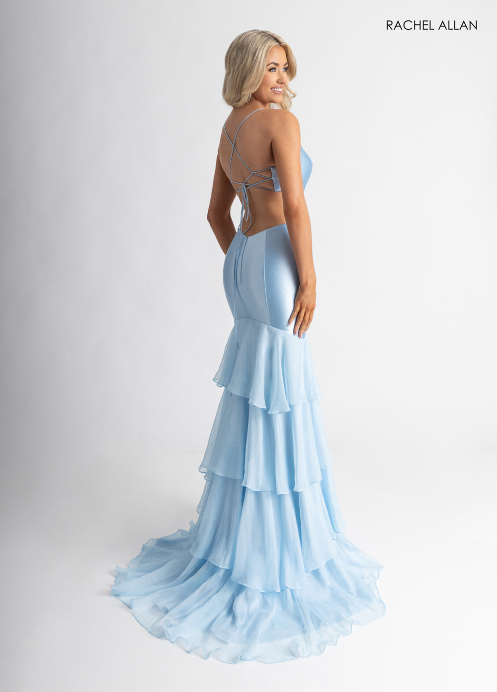 Rachel Allan 71027 Light blue mermaid prom dress with layered chiffon and lace-up back detail.