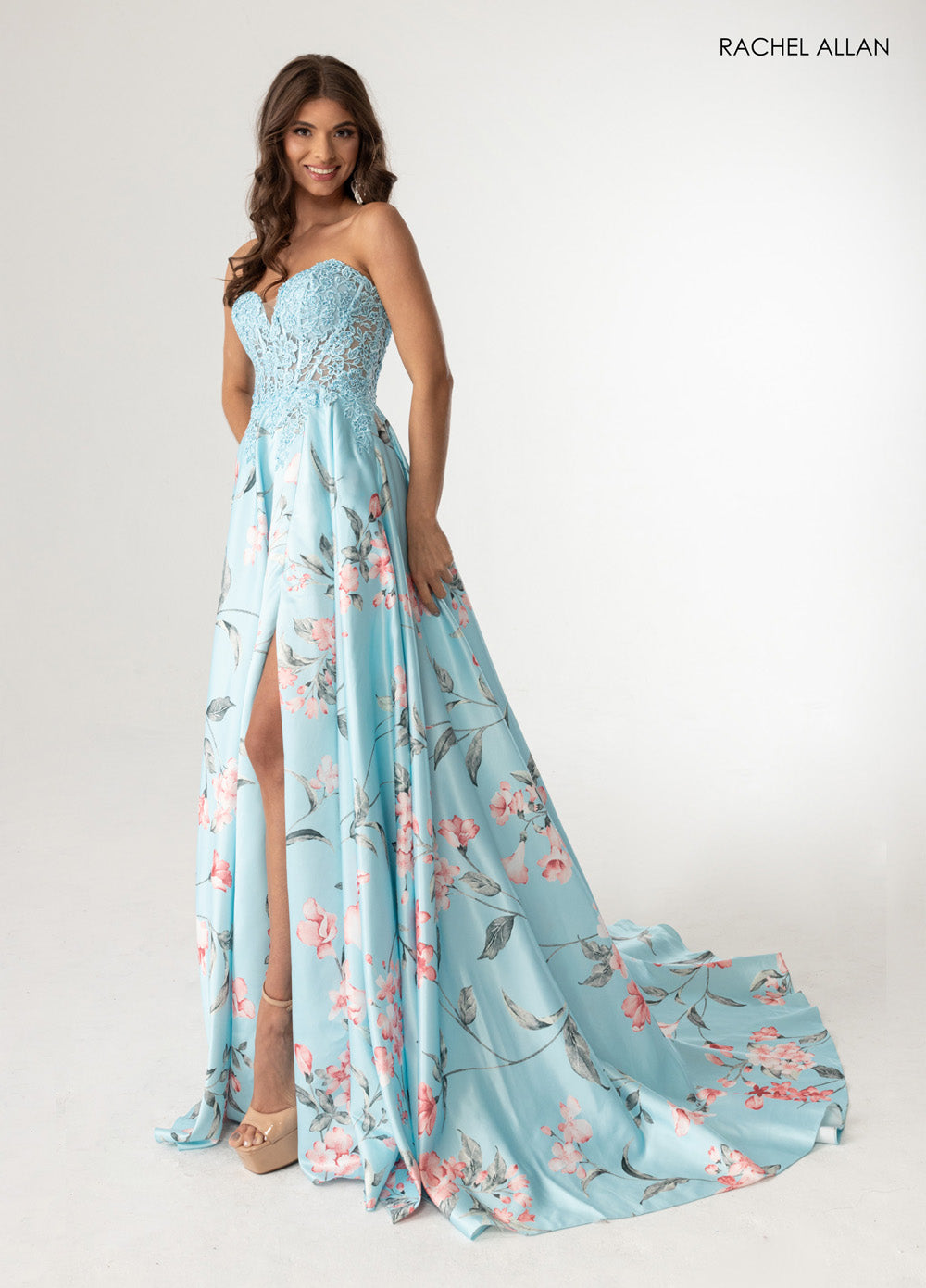 Rachel Allan 71031 Sky blue multi prom dress with floral print, fitted bodice, and high slit.