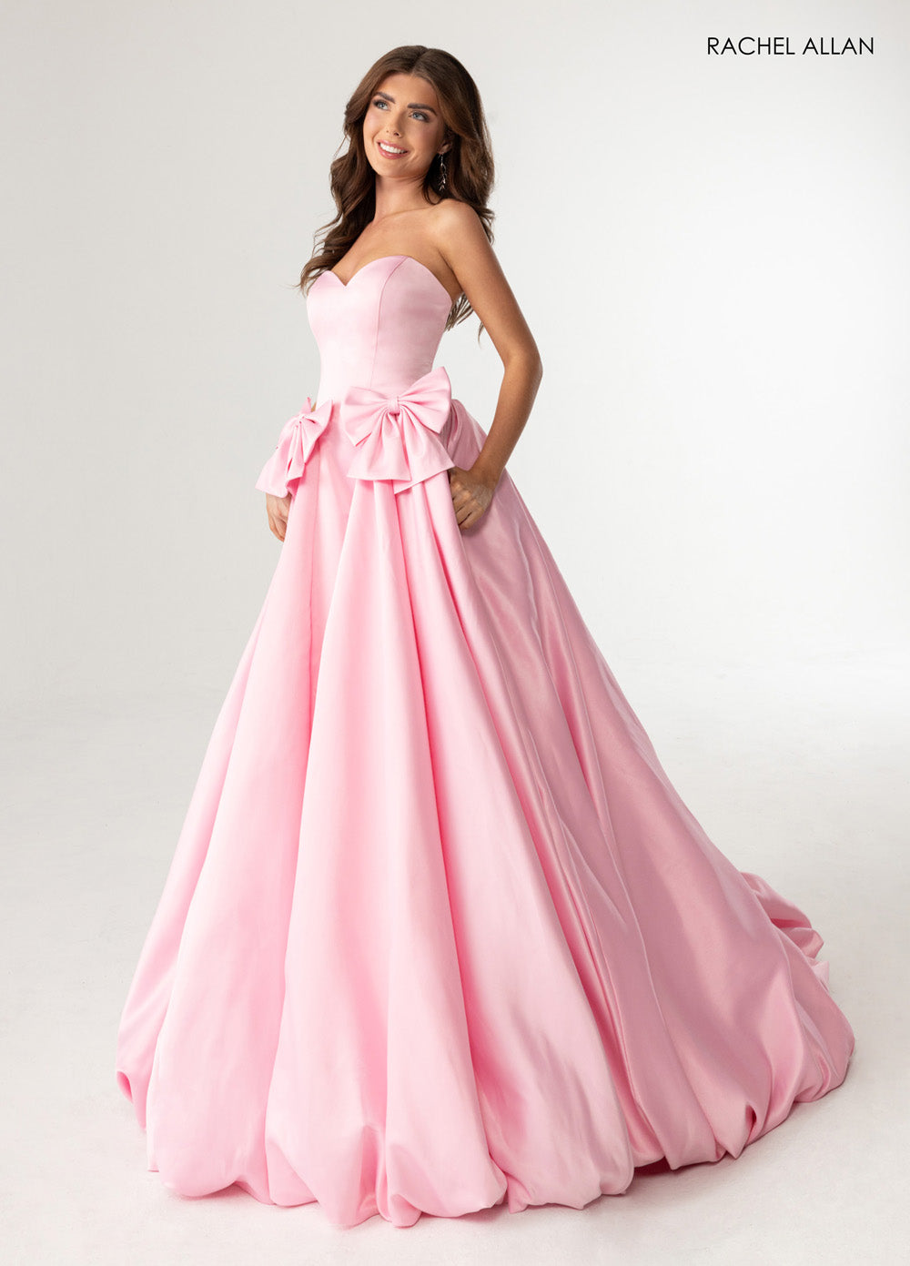 Rachel Allan 71035 Pink ballgown with bow details and sweetheart neckline, perfect for prom prom dress.
