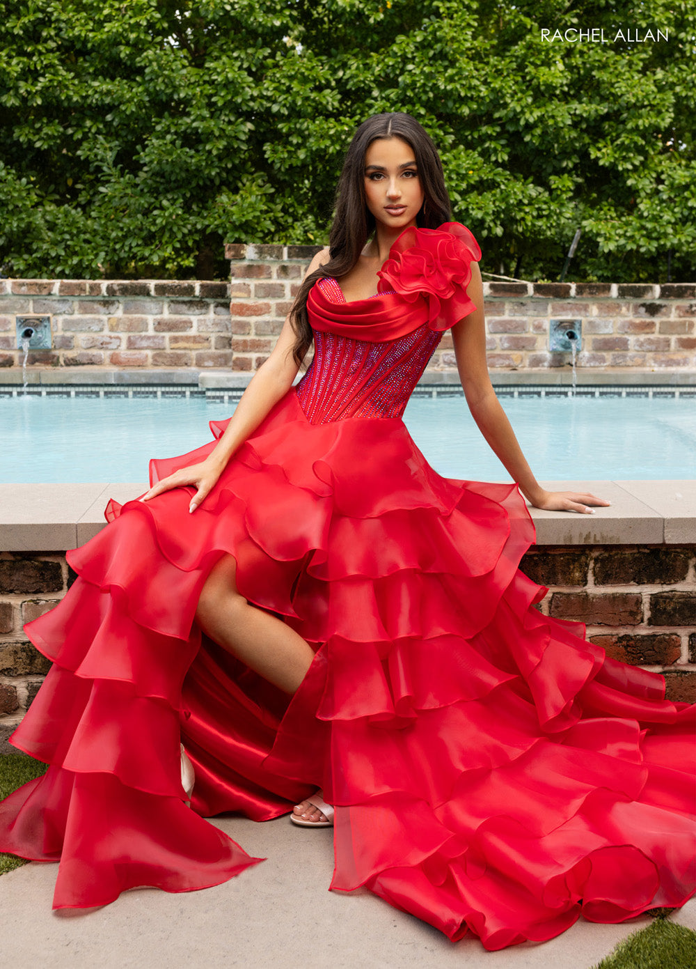 Rachel Allan 71049 Red prom dress with ruffled layers and crystal beading, featuring a side slit.
