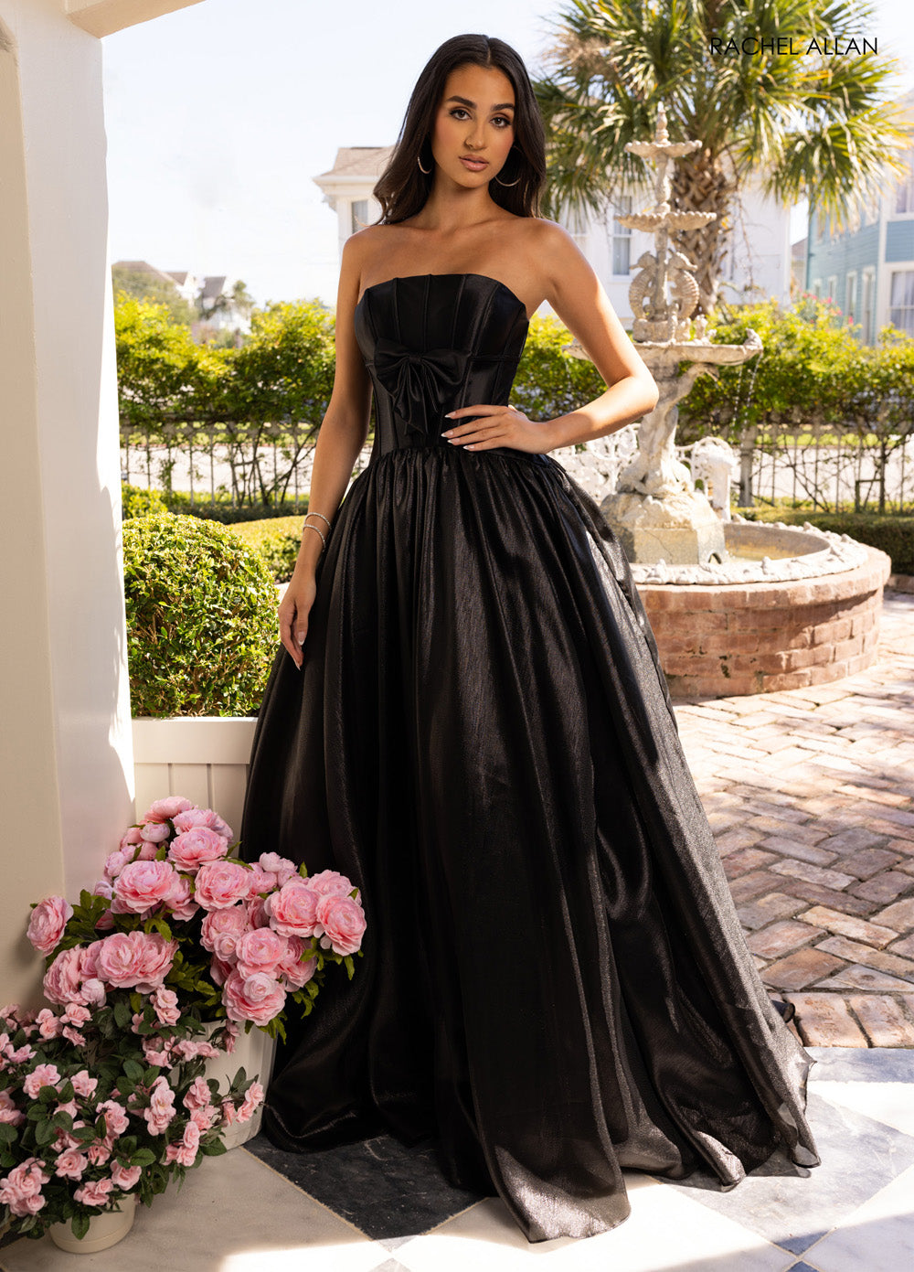 Rachel Allan 71060 Strapless black prom dress with a fitted bodice and flowing skirt.