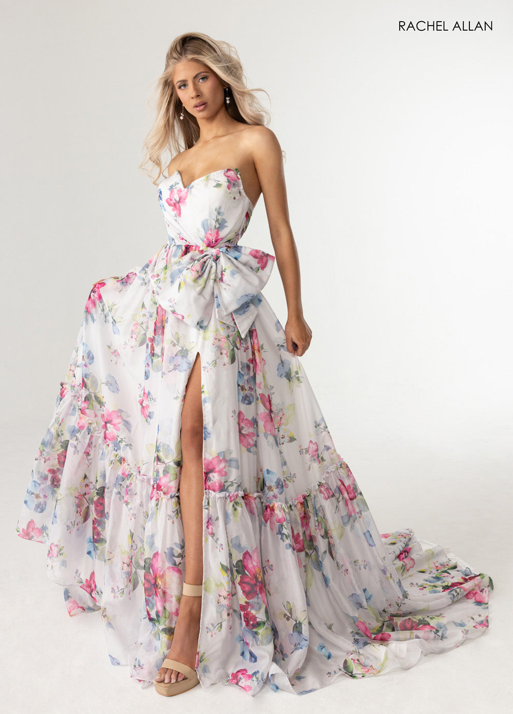 Rachel Allan 71065 Strapless white multi prom dress with floral print and high slit detail.