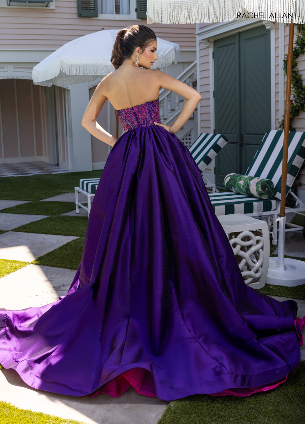 Rachel Allan 71068 Strapless mermaid prom dress in ultraviolet fuchsia with intricate beading, back view.
