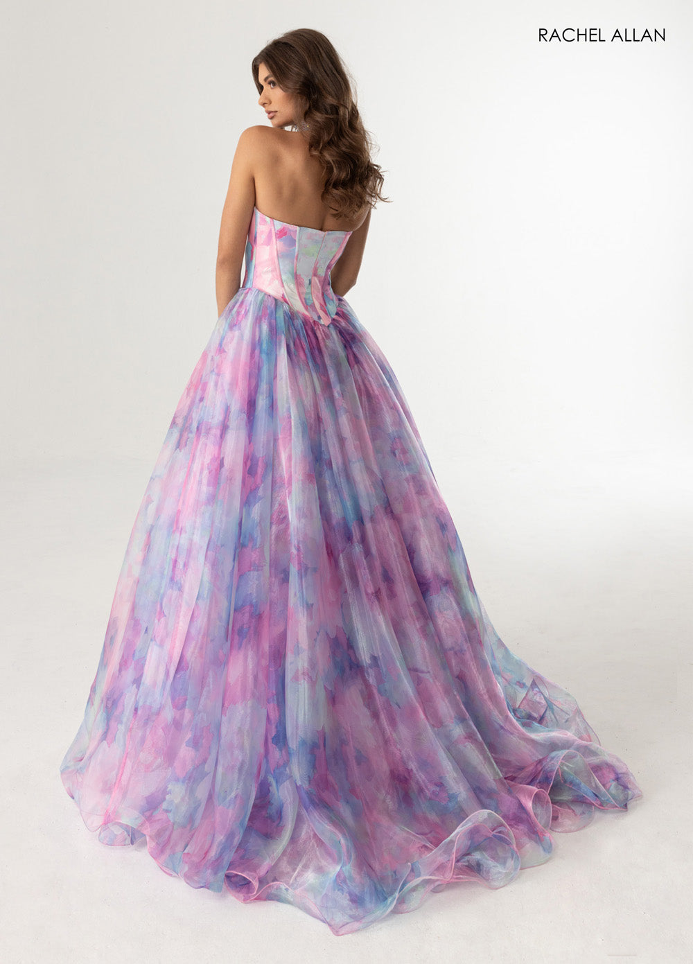 Rachel Allan 71069 Pink multi A-line prom dress with a flowing skirt and a lace-up back.