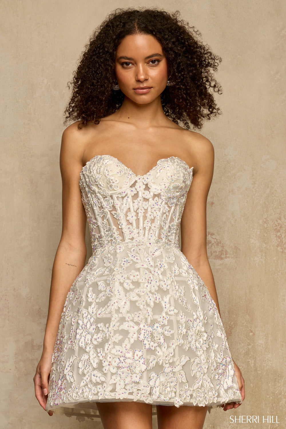 Close front view of Sherri Hill 58206 in ivory highlighting boned sweetheart bodice and iridescent AB rhinestone embellishments.
