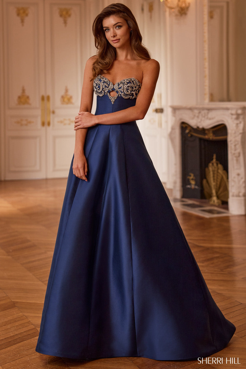 Sherri Hill 58277 navy ballgown full-length front view with crystal scroll sweetheart bodice and voluminous skirt in grand ballroom setting