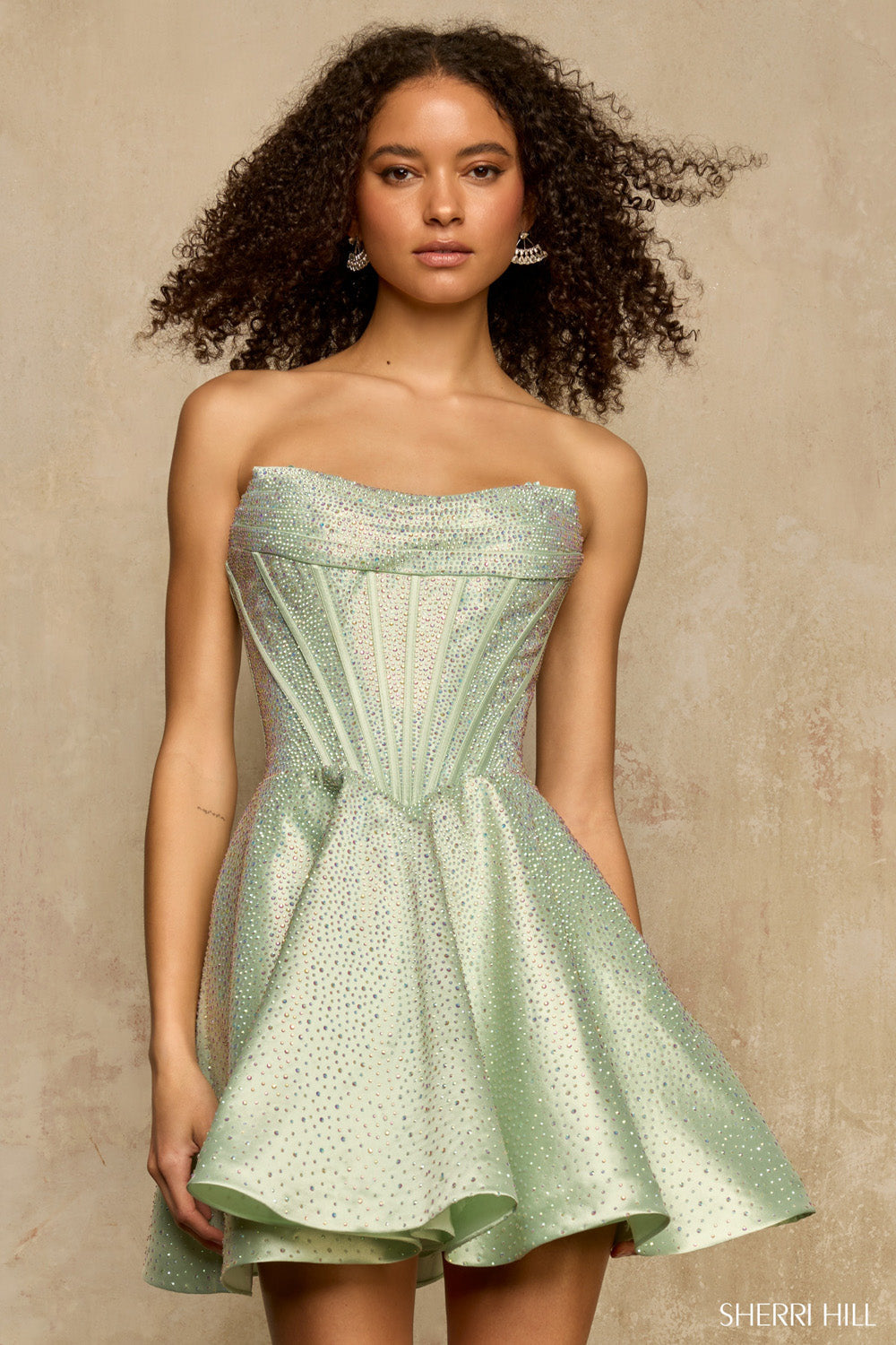 Close front view of Sherri Hill 58328 in sage — detailed boning channels, all-over rhinestone embellishment, sculpted mini silhouette.
